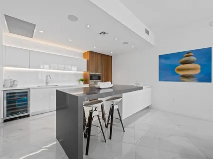 a kitchen with a sink cabinets and window