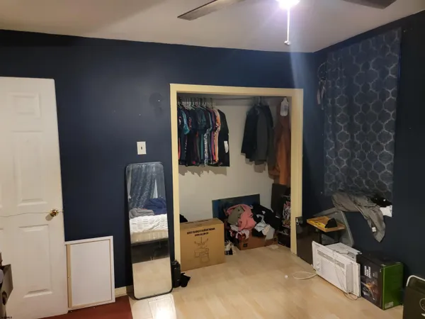 a view of a hallway with workspace and mirror