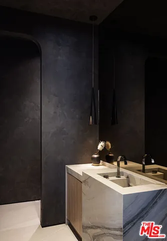 a bathroom with a bathtub and potted plant