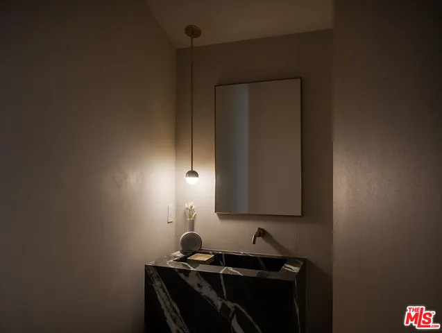 a living room with furniture rug and a fireplace