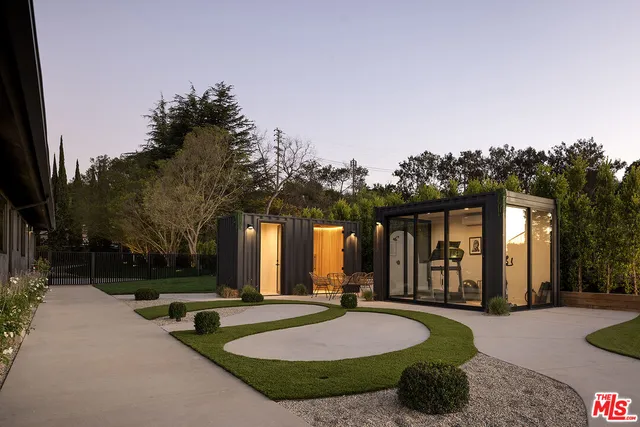 a living room with furniture and a lamp