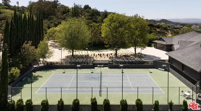 a view of a swimming pool with a yard