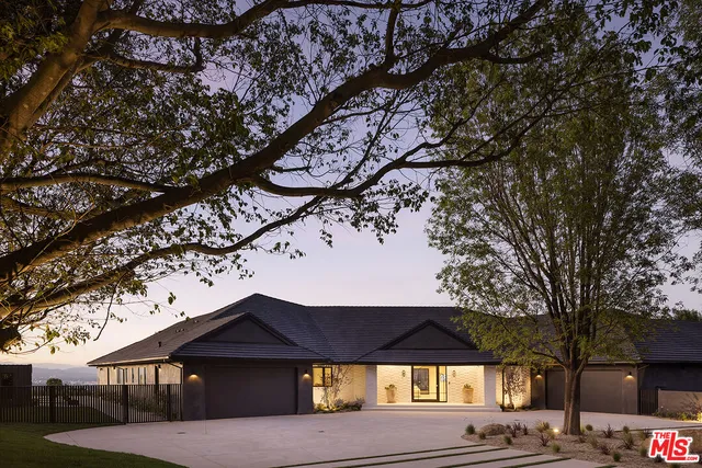a view of a patio with a yard