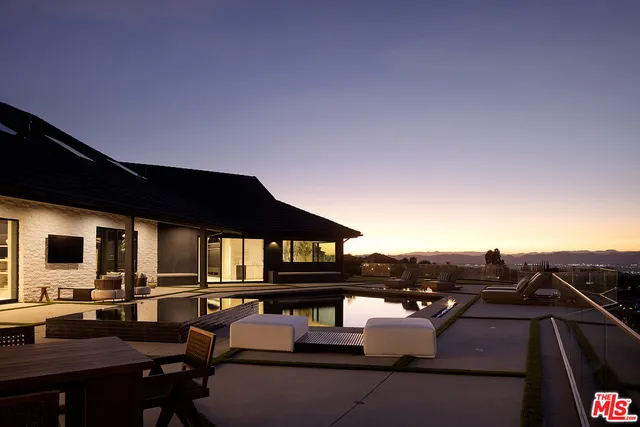 a view of a big house with a big yard