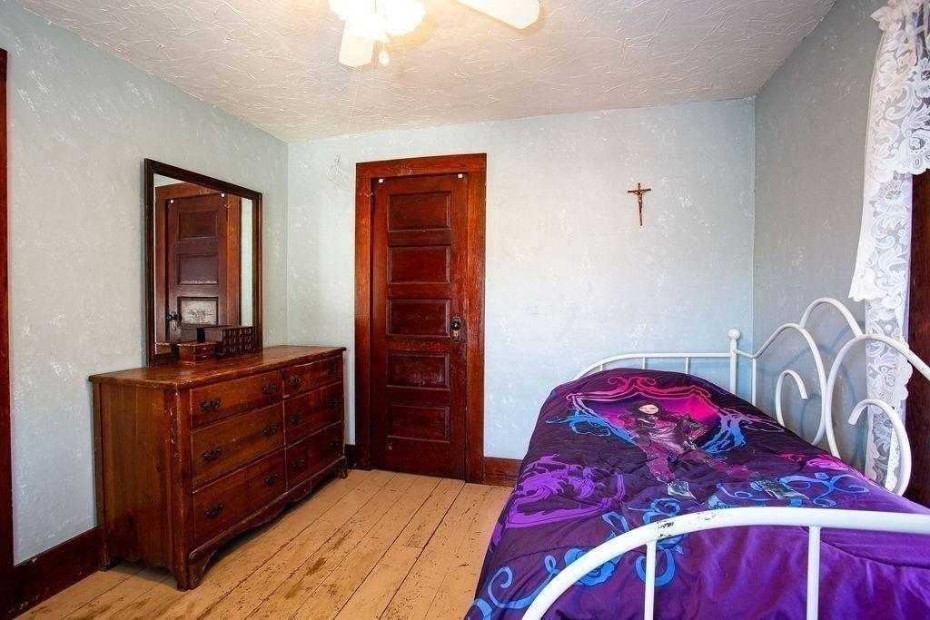 2018 Oak Street Three Rivers, MA 01080 - Photo 33 of 42 a bedroom with a bed and a dresser