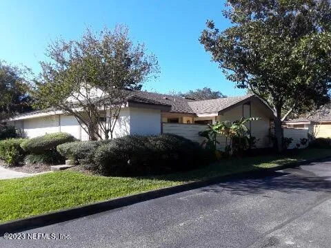 a view of a house with a garden