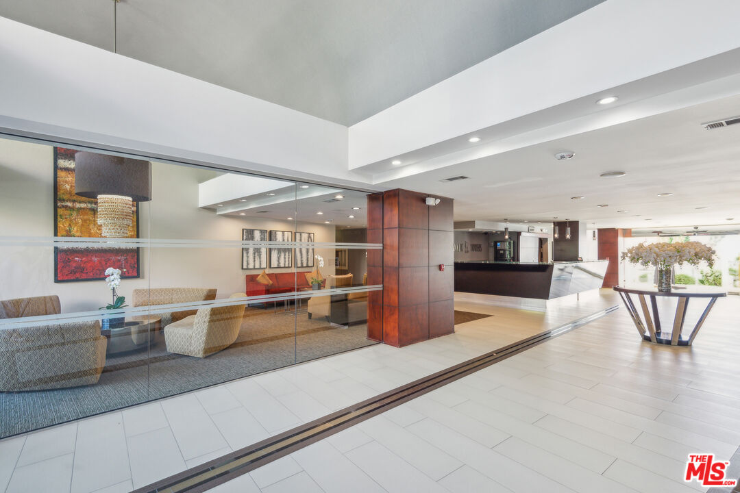 7250 Franklin Avenue, Unit 512 Los Angeles, CA 90046 - Photo 21 of 28 a living room with furniture and a table