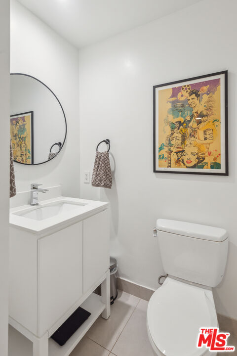 7250 Franklin Avenue, Unit 512 Los Angeles, CA 90046 - Photo 5 of 28 a white toilet sitting next to a bathroom sink