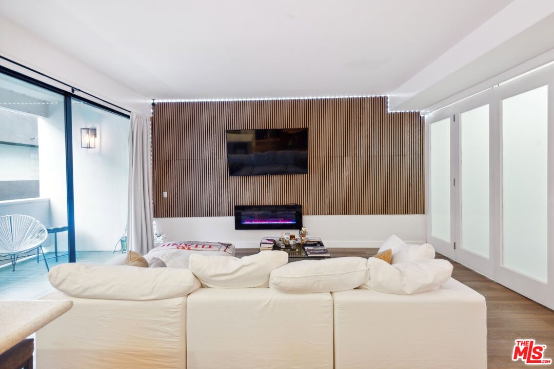 7250 Franklin Avenue, Unit 512 Los Angeles, CA 90046 - Photo 8 of 28 a living room with furniture and a flat screen tv