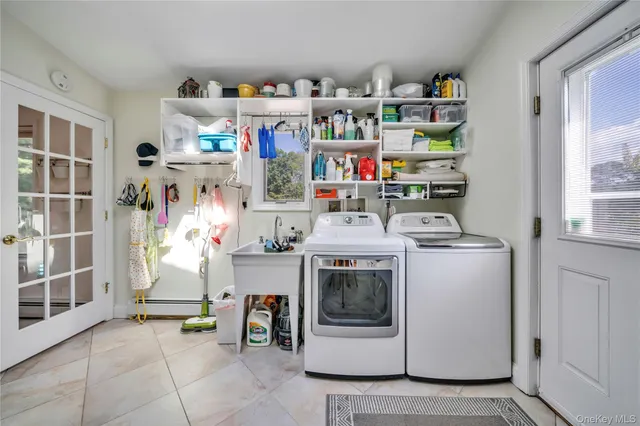 a utility room with dryer and washer