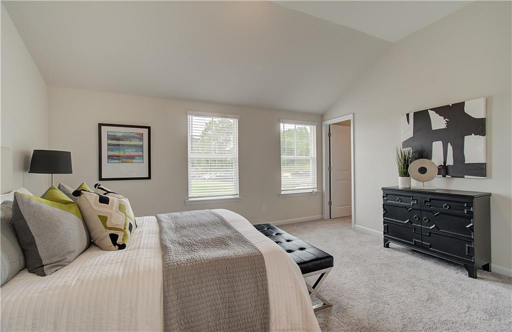 477 Collier Mls Road Lawrenceville, GA 30045 - Photo 25 of 40 a bedroom with a bed and a dresser in it
