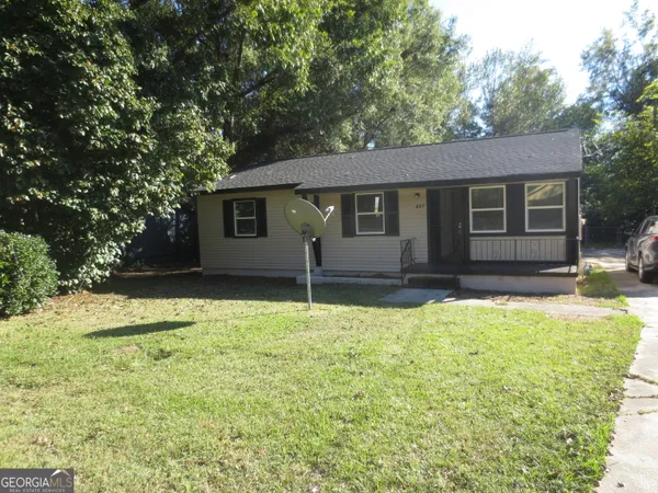 a house with trees in the background