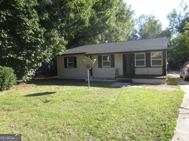 a house with trees in the background