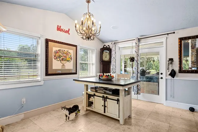 a view of a room with workspace and windows