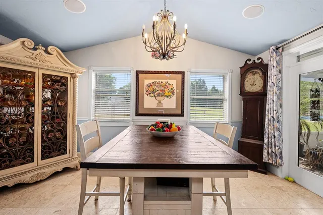 a view of a dining room with furniture and window