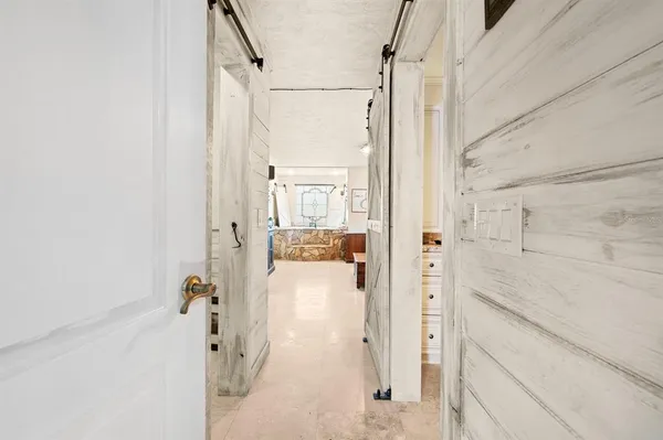 a bathroom with a shower and a sink