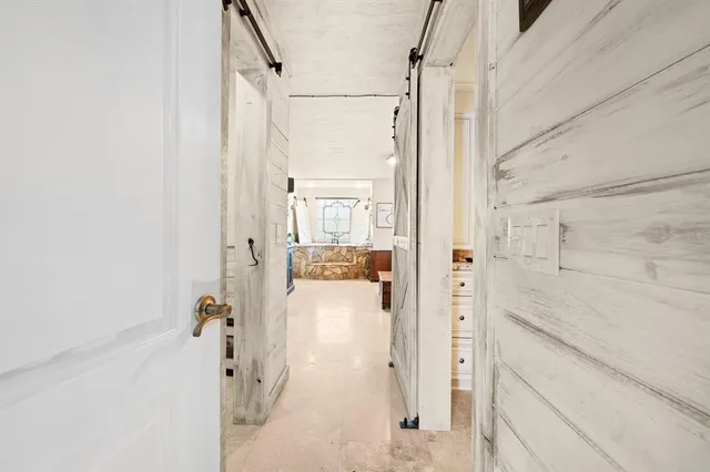 a bathroom with a shower and a sink
