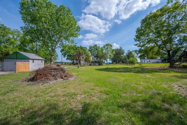 a view of a house with a big yard