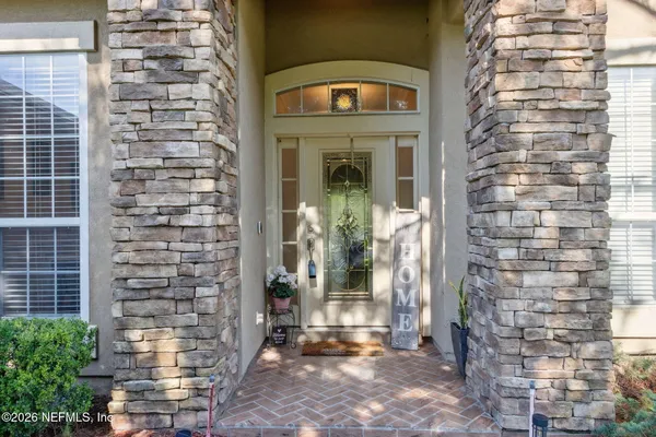 a view of front door of house with an outdoor space