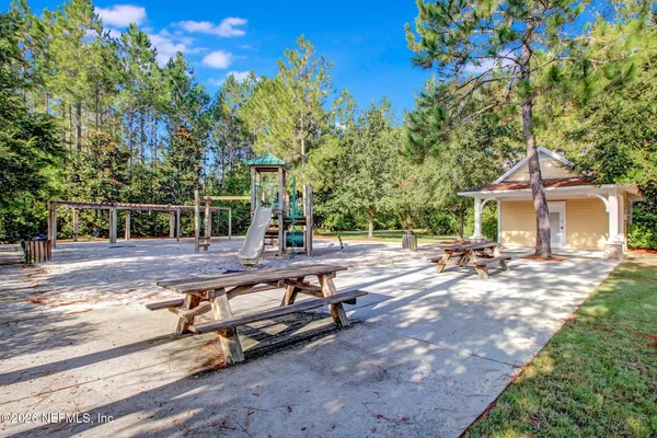 a view of a patio with a table chairs and a table