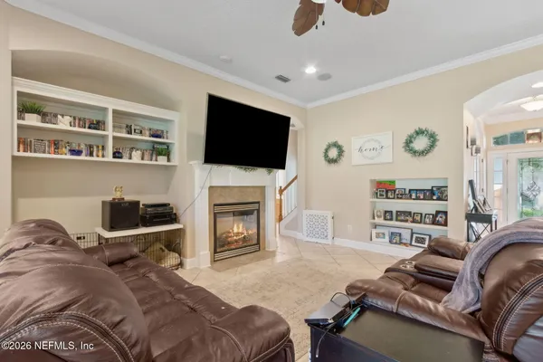 a living room with furniture and a large window