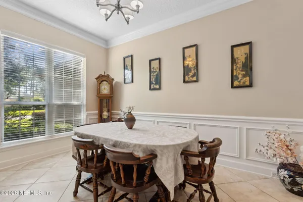 a view of a dining room with furniture window and outside view