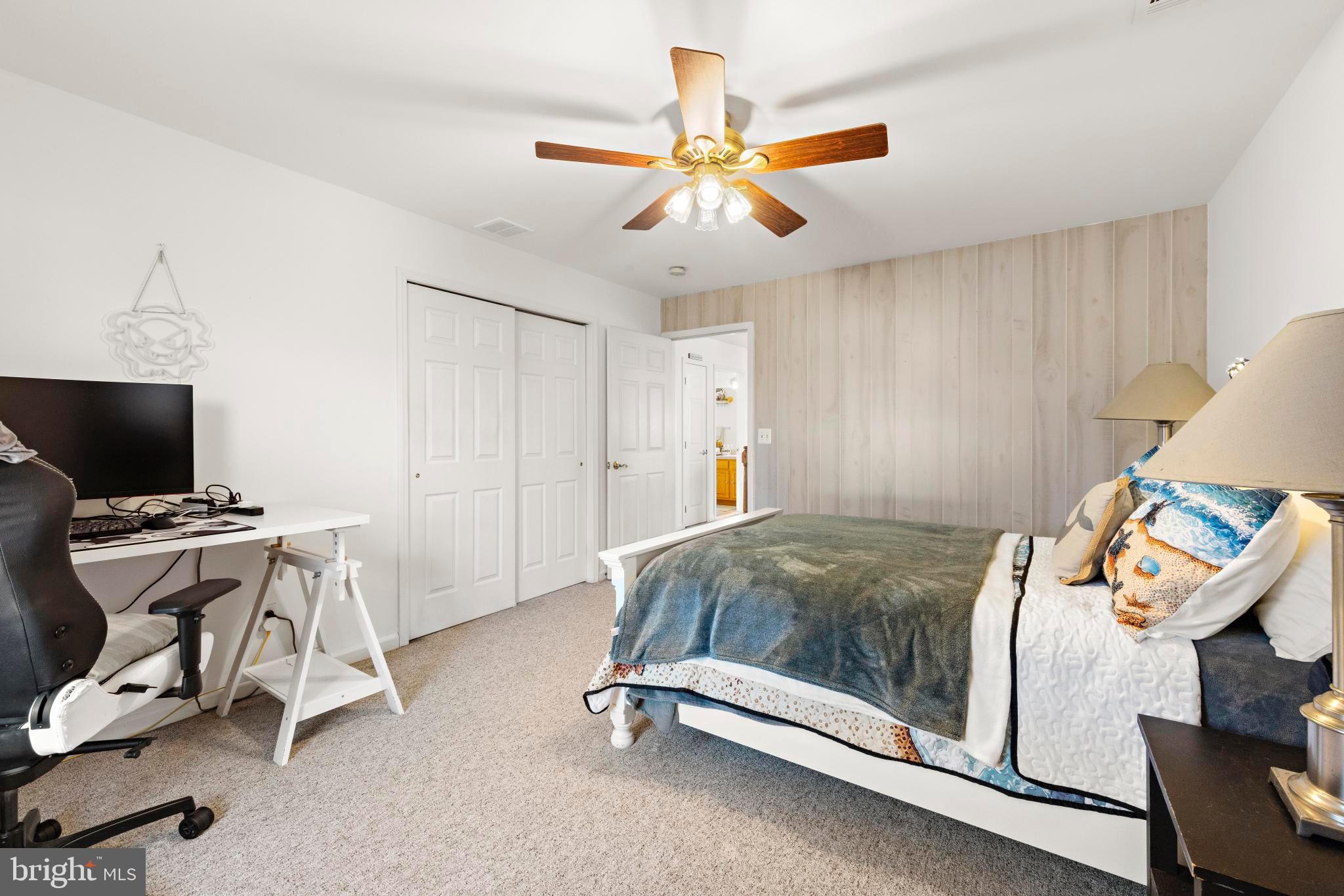 3 Hay Road Tuckerton, NJ 08087 - Photo 32 of 50 a bedroom with a bed and a chandelier