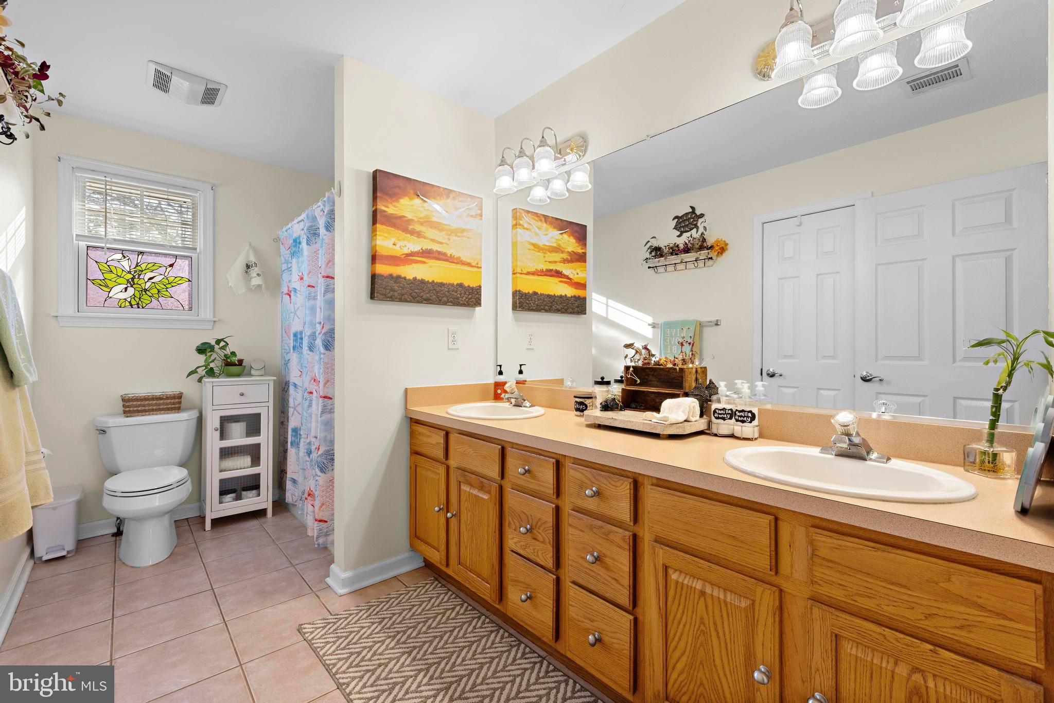3 Hay Road Tuckerton, NJ 08087 - Photo 33 of 50 a bathroom with a double vanity sink mirror and toilet