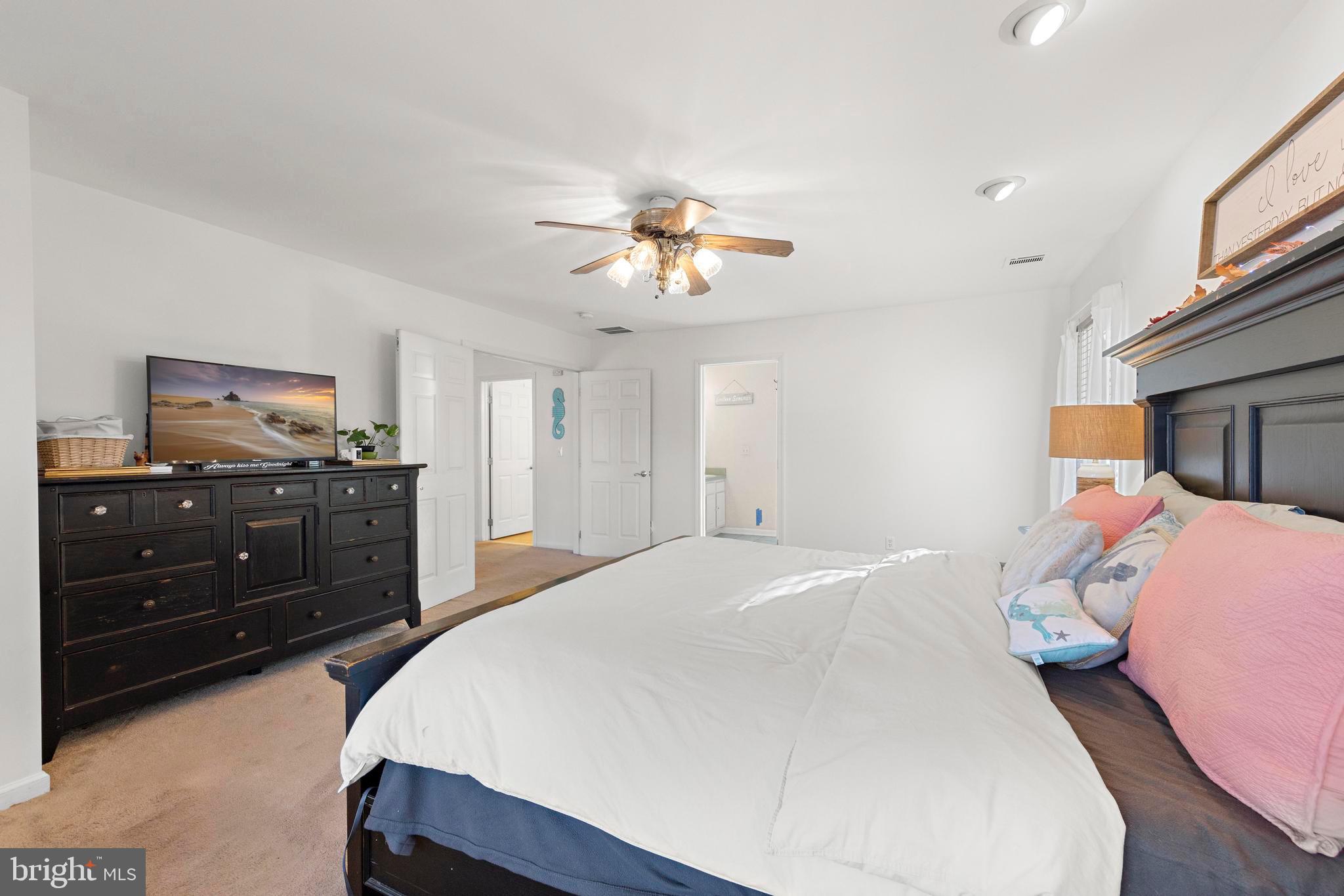 3 Hay Road Tuckerton, NJ 08087 - Photo 38 of 50 a bedroom with a bed and a chandelier