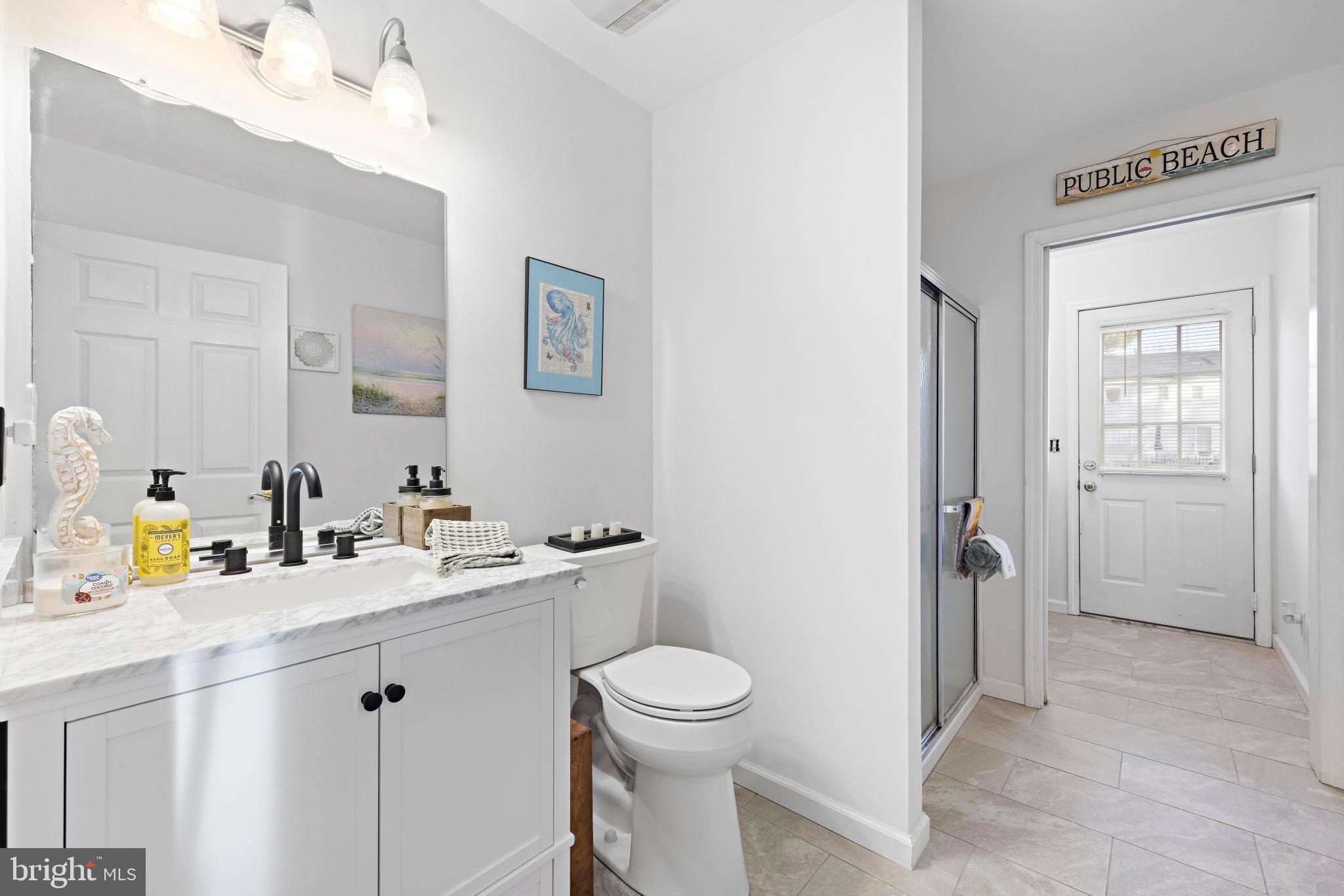 3 Hay Road Tuckerton, NJ 08087 - Photo 41 of 50 a bathroom with a granite countertop sink a toilet and a mirror
