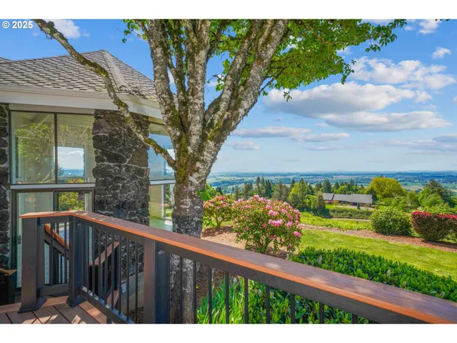 a view of a wooden fence and a big yard