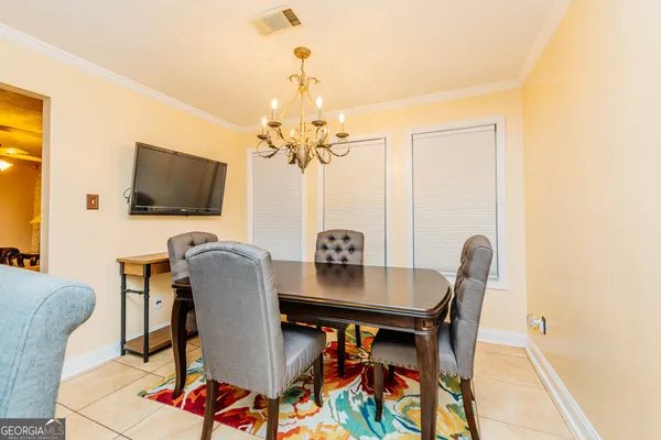 a kitchen with a large window and cabinets