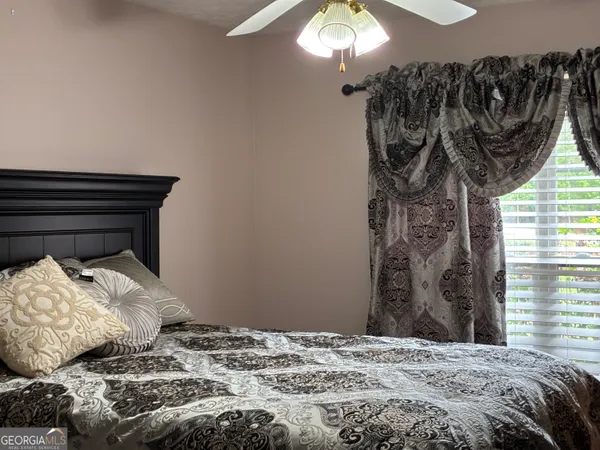 a dining room with a table and chairs