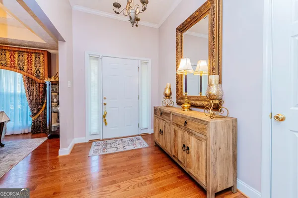 a kitchen with a sink and a refrigerator