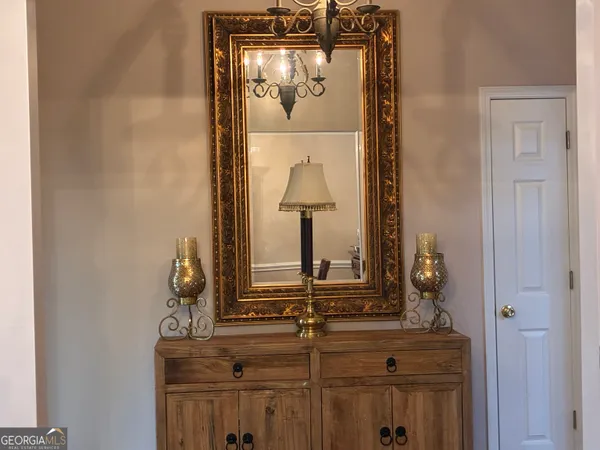 a kitchen with granite countertop a refrigerator and a sink