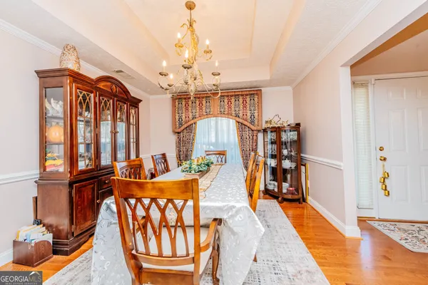 a kitchen with a sink and a fireplace with wooden floor