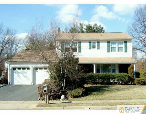 2 Meredith Road Edison, NJ 08817 - Photo 1 of 5 a front view of a house with garden