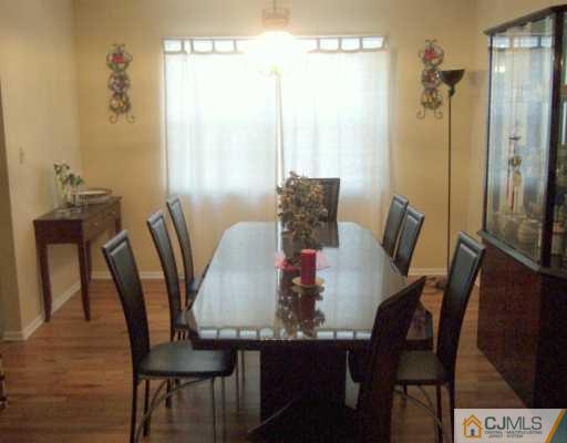 2 Meredith Road Edison, NJ 08817 - Photo 4 of 5 a view of a dining room with furniture and wooden floor