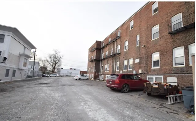 a view of a cars parked in front of a building
