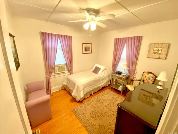 a spacious bedroom with a bed and a couch