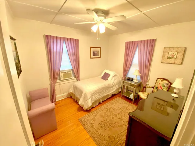 a spacious bedroom with a bed and a couch