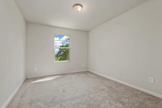 a bedroom with a bed and a tv