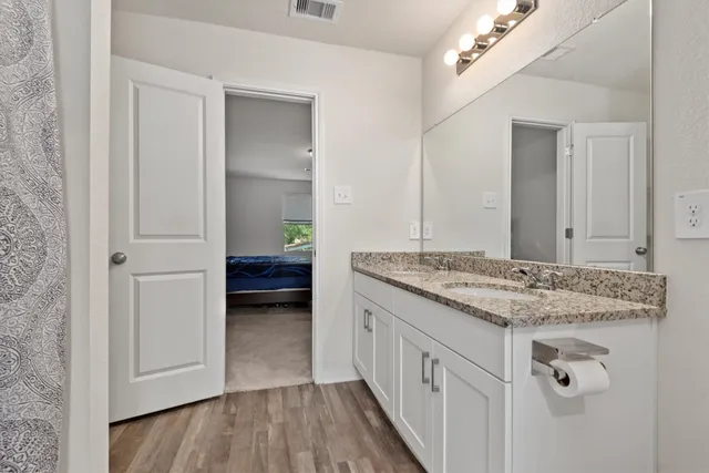 walk in closet with clothes and shoes