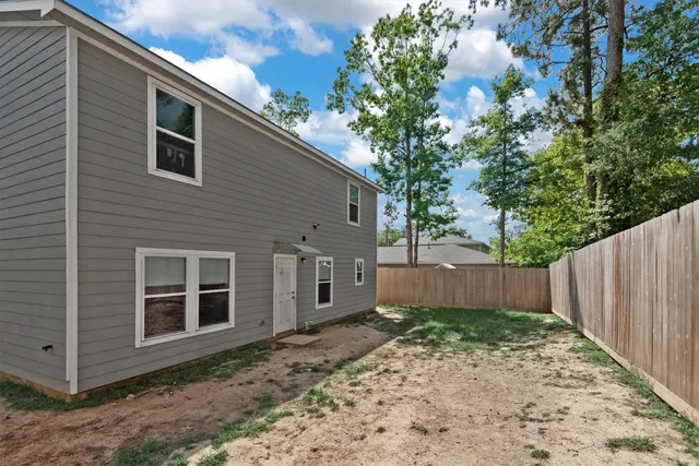 a backyard of a house with lots of green space