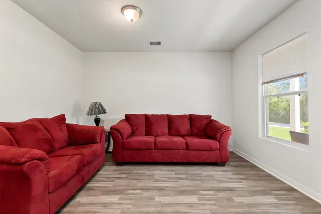 a blue couch sitting in a living room with a couch