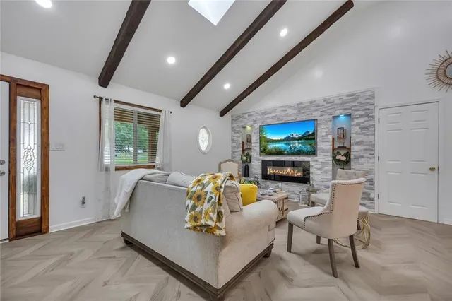 a living room with furniture and a flat screen tv