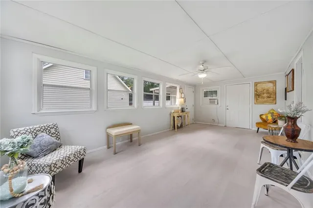 a living room with furniture and a window