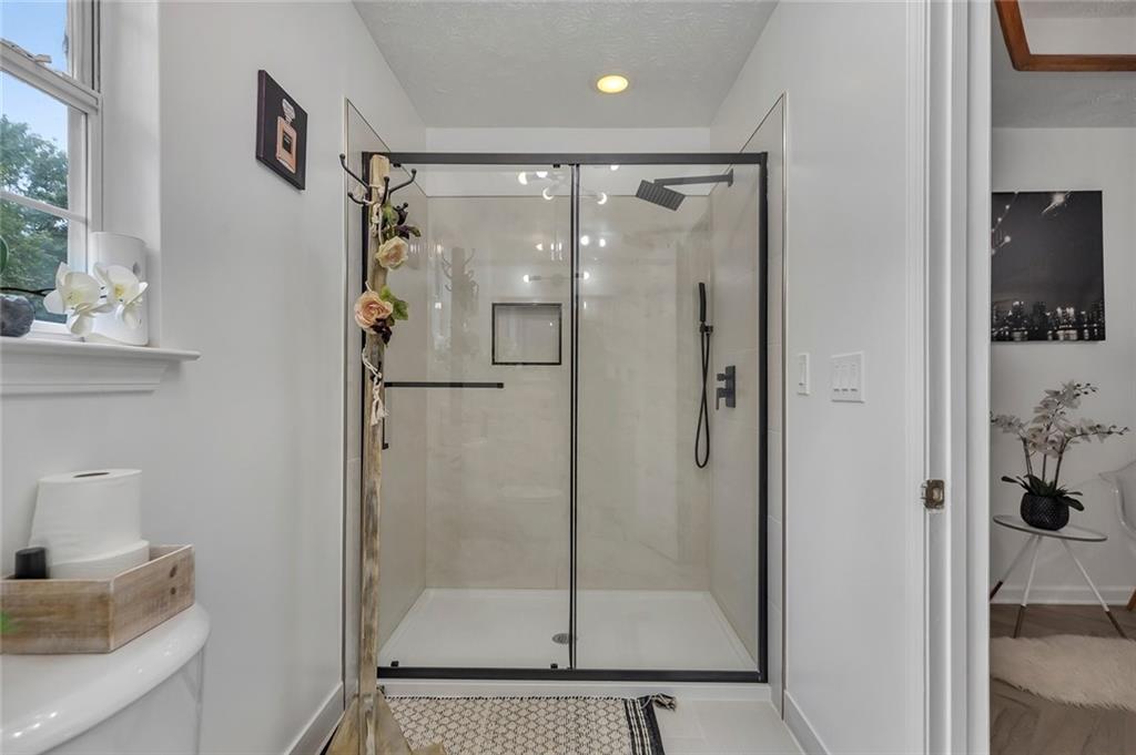 52 Glenda Drive Southwest Rome, GA 30165 - Photo 29 of 50 a bathroom with a shower and a sink
