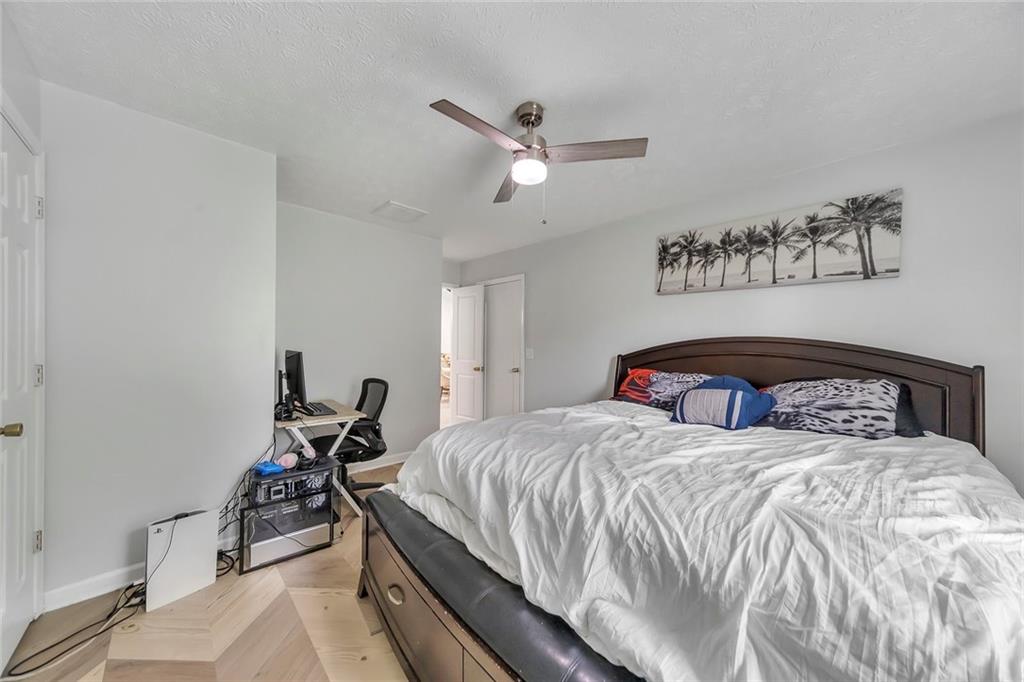 52 Glenda Drive Southwest Rome, GA 30165 - Photo 35 of 50 a bedroom with a bed and a ceiling fan