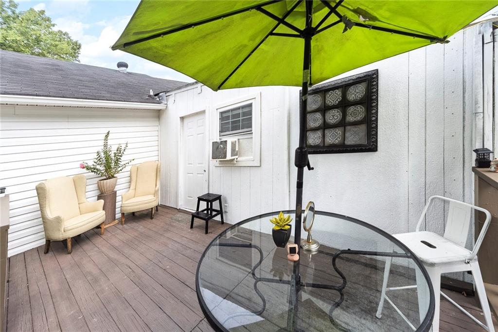 52 Glenda Drive Southwest Rome, GA 30165 - Photo 43 of 50 a patio with a table and chairs under an umbrella